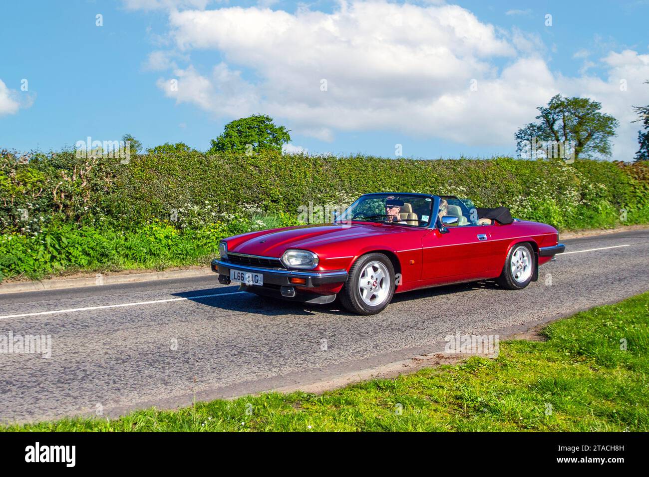 1993 90s nineties Red British Jaguar Xj-S Convertible Auto,  7.0 litre V12; Vintage, restored classic motors, automobile collectors motoring enthusiasts, historic veteran cars travelling in Cheshire, UK Stock Photo