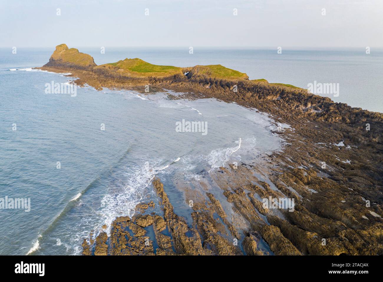 Aerial view of Worm's Head promontory on the Gower Peninsula, South Wales, UK. Spring (March) 2022. Stock Photo