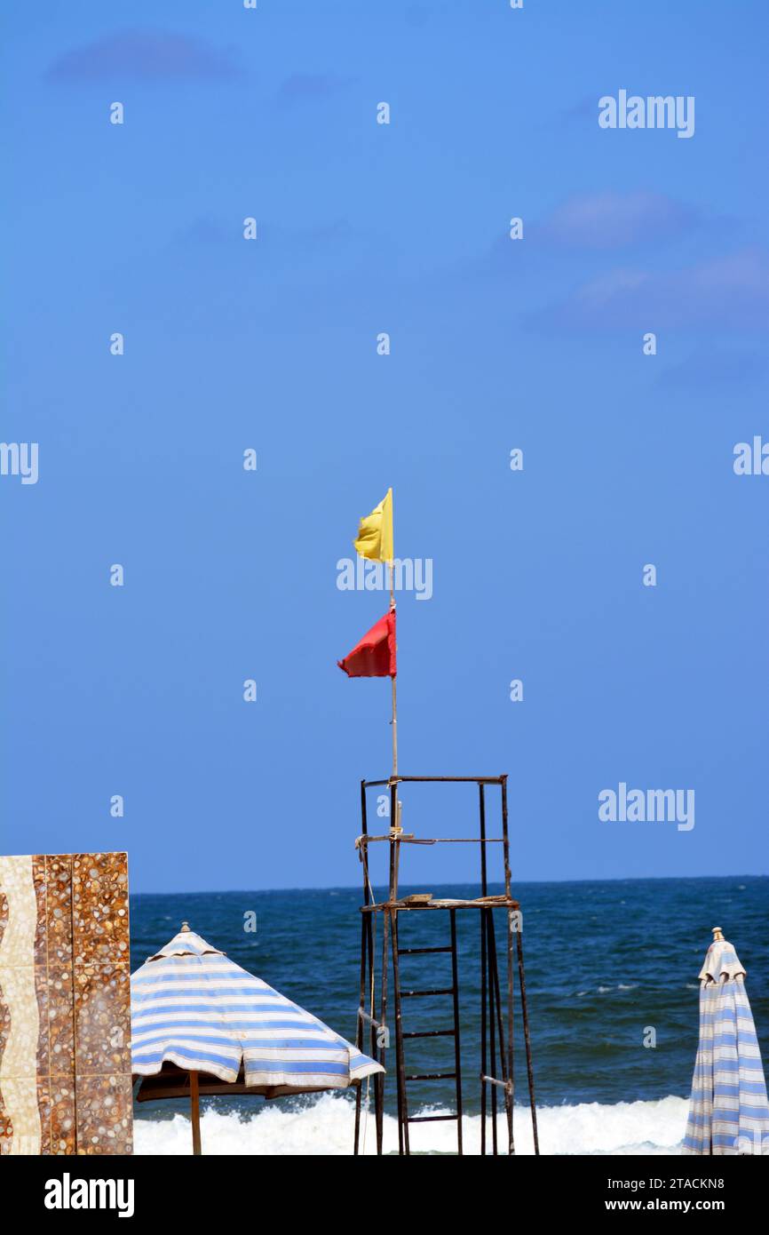 Yellow and red flags on the beach, beach warning flag system, red flag