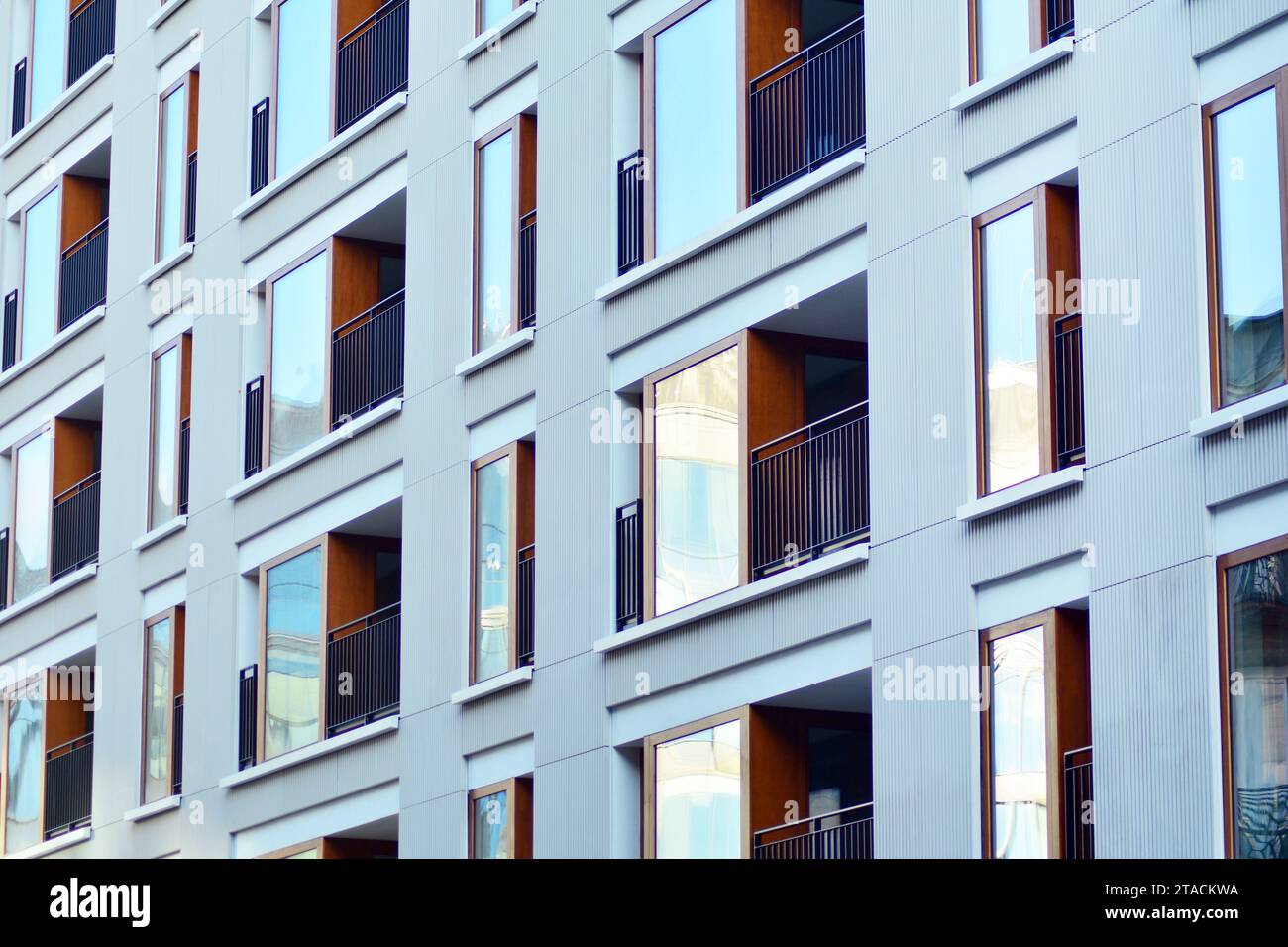 New apartment building with glass balconies. Modern architecture houses ...