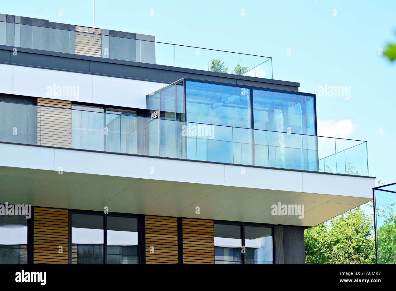 New apartment building with glass balconies. Modern architecture houses ...