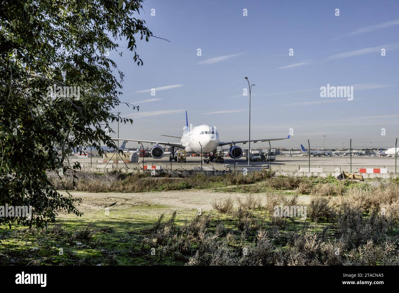 Cargo planes receiving fuel and refueling on the runway Stock Photo
