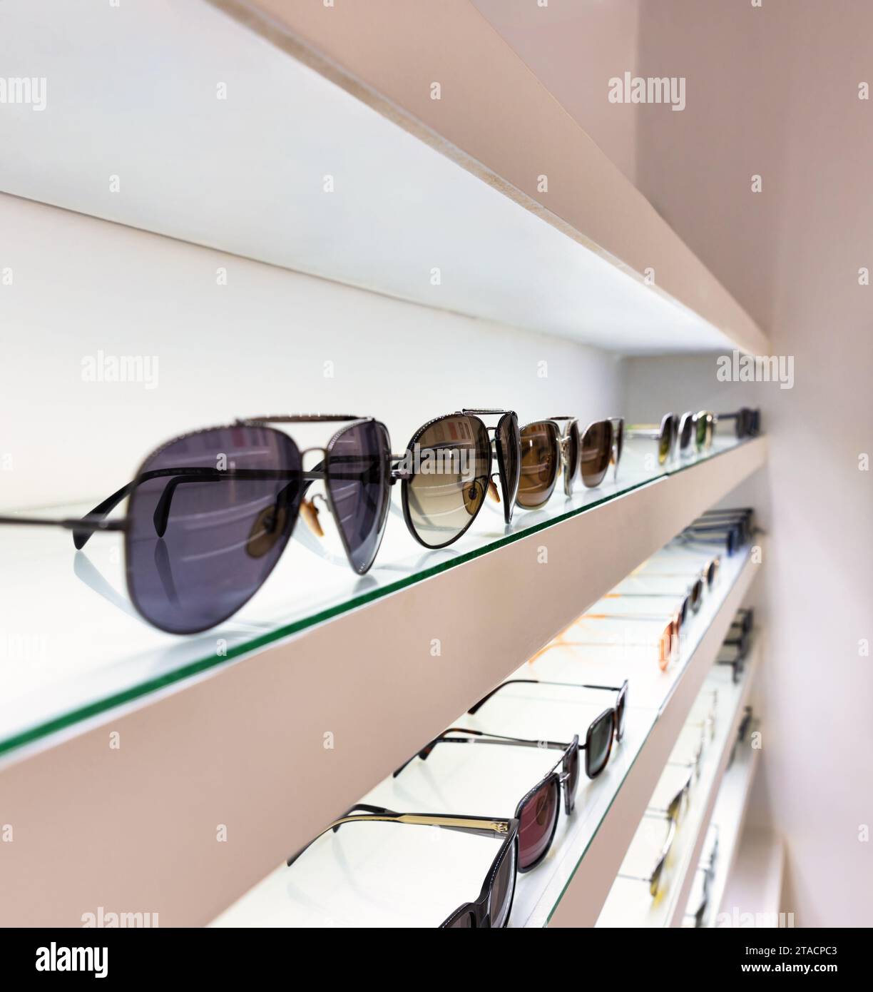 shelves with modern flamboyant luxury branded sunglasses Stock Photo