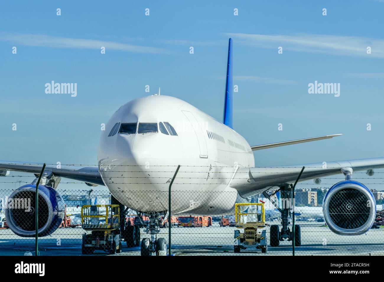 An airplane loads on the runway receiving inspection Stock Photo
