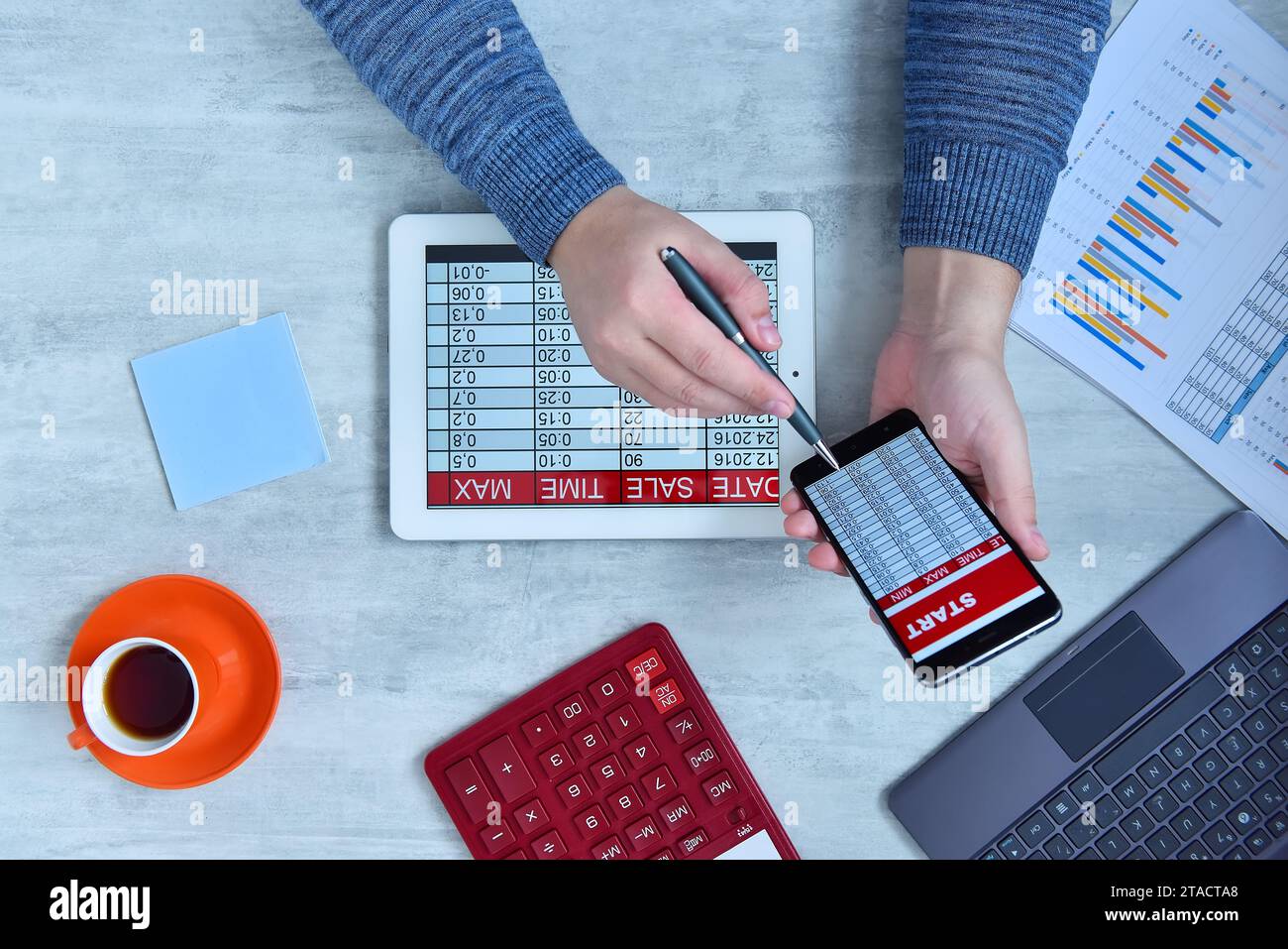 Businessman doing business and charts being demonstrated on screen of a ...