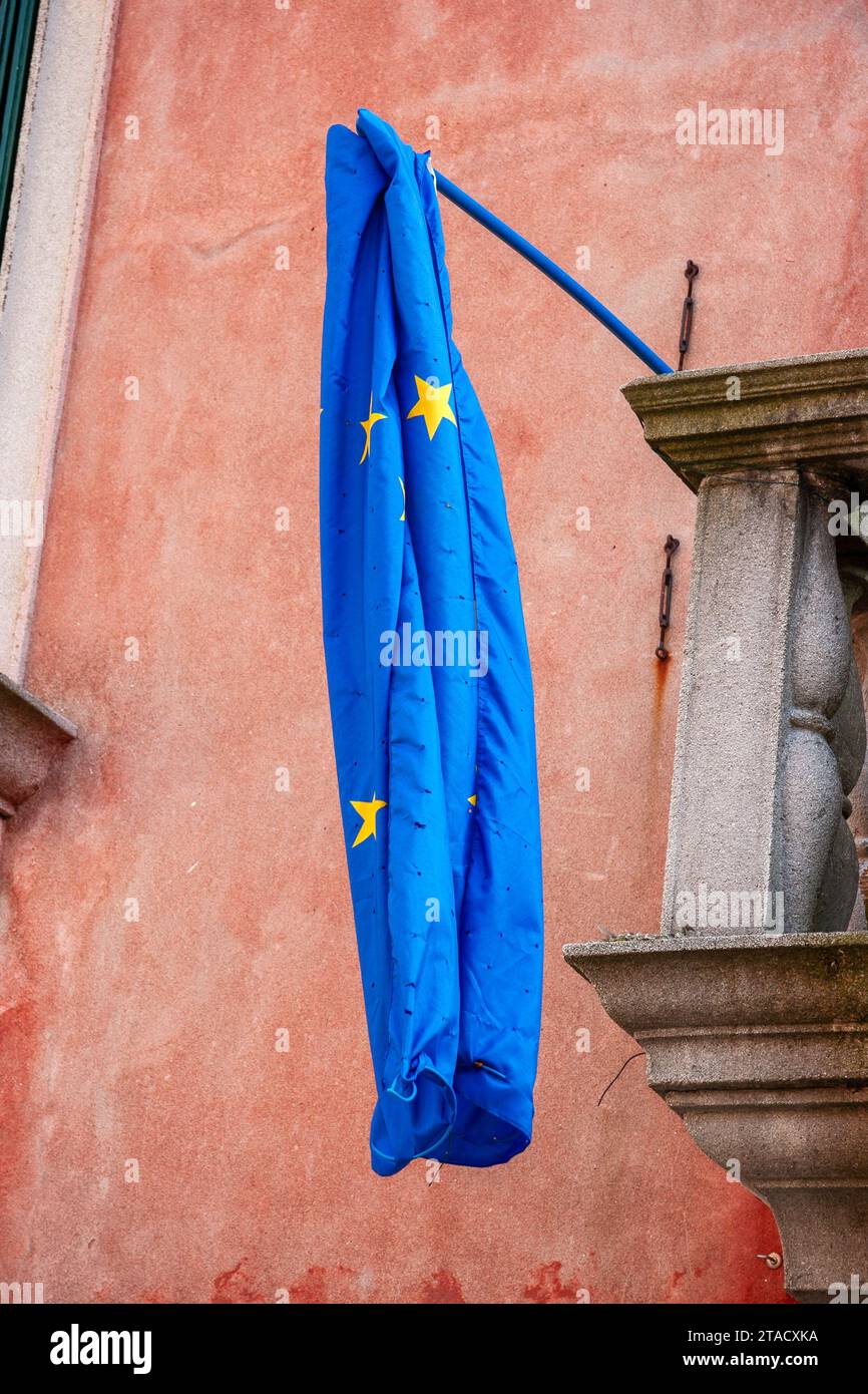 Flag of the European Union hanging limply on a house. Venice, Italy Stock Photo