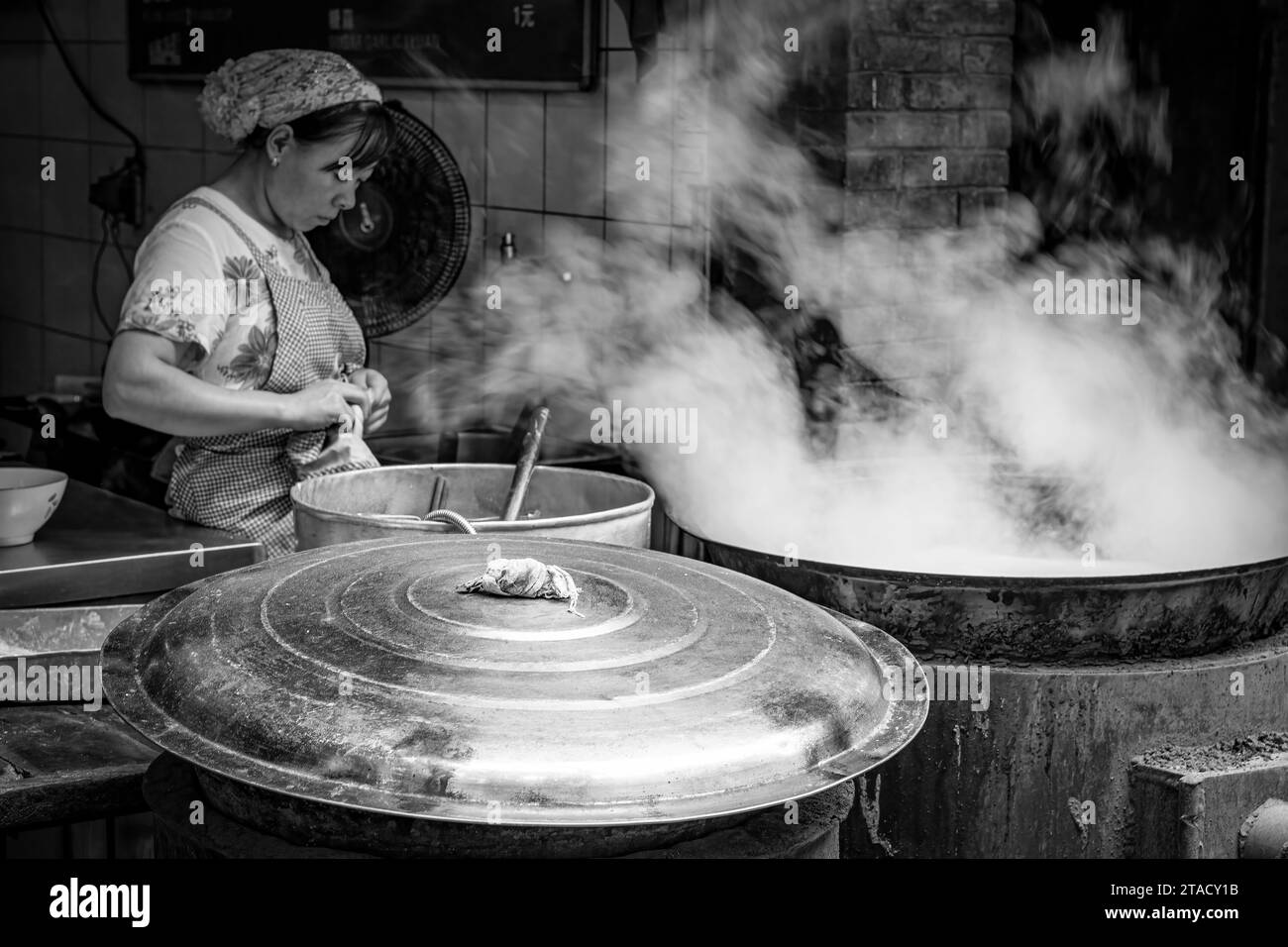 Cooking in big pots in Xian in China, August 14, 2014 Stock Photo