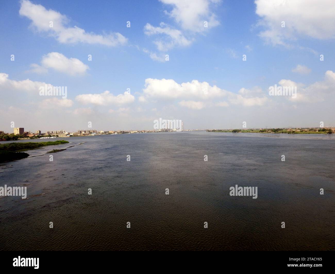 Giza, Egypt, September 9 2022: The Nile river in Egypt, with a village ...