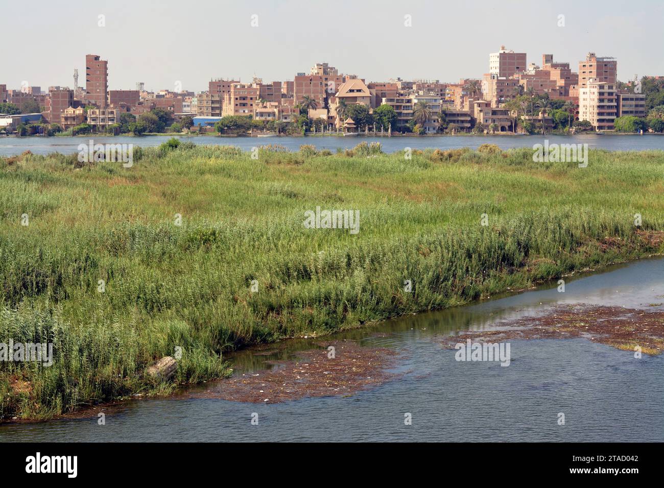 Giza, Egypt, September 9 2022: The Nile river in Egypt, with a village ...