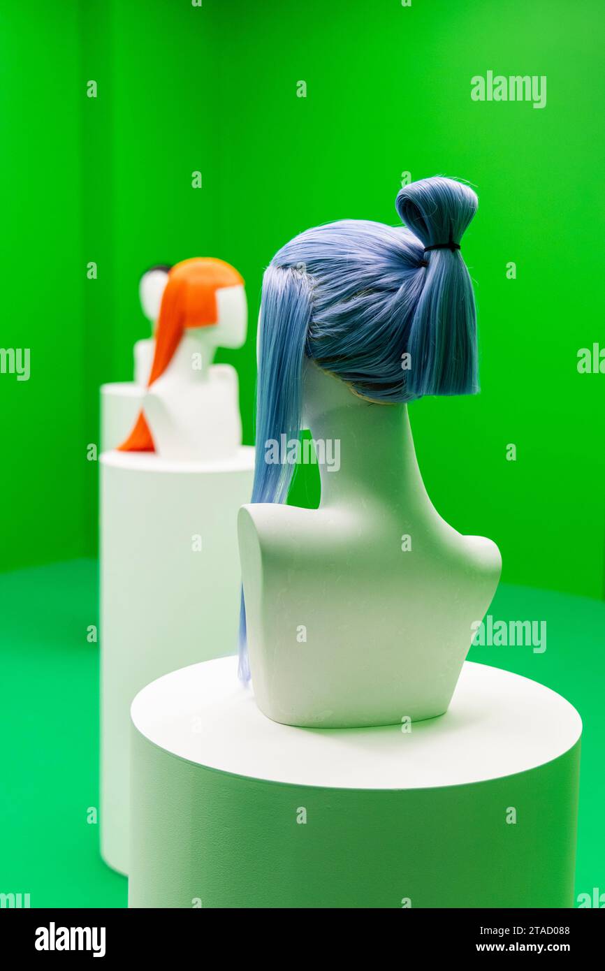 Colourful wigs at the Sin Wai Kin 'Portraits' exhibition (2023) at Soft Opening gallery, London, England Stock Photo