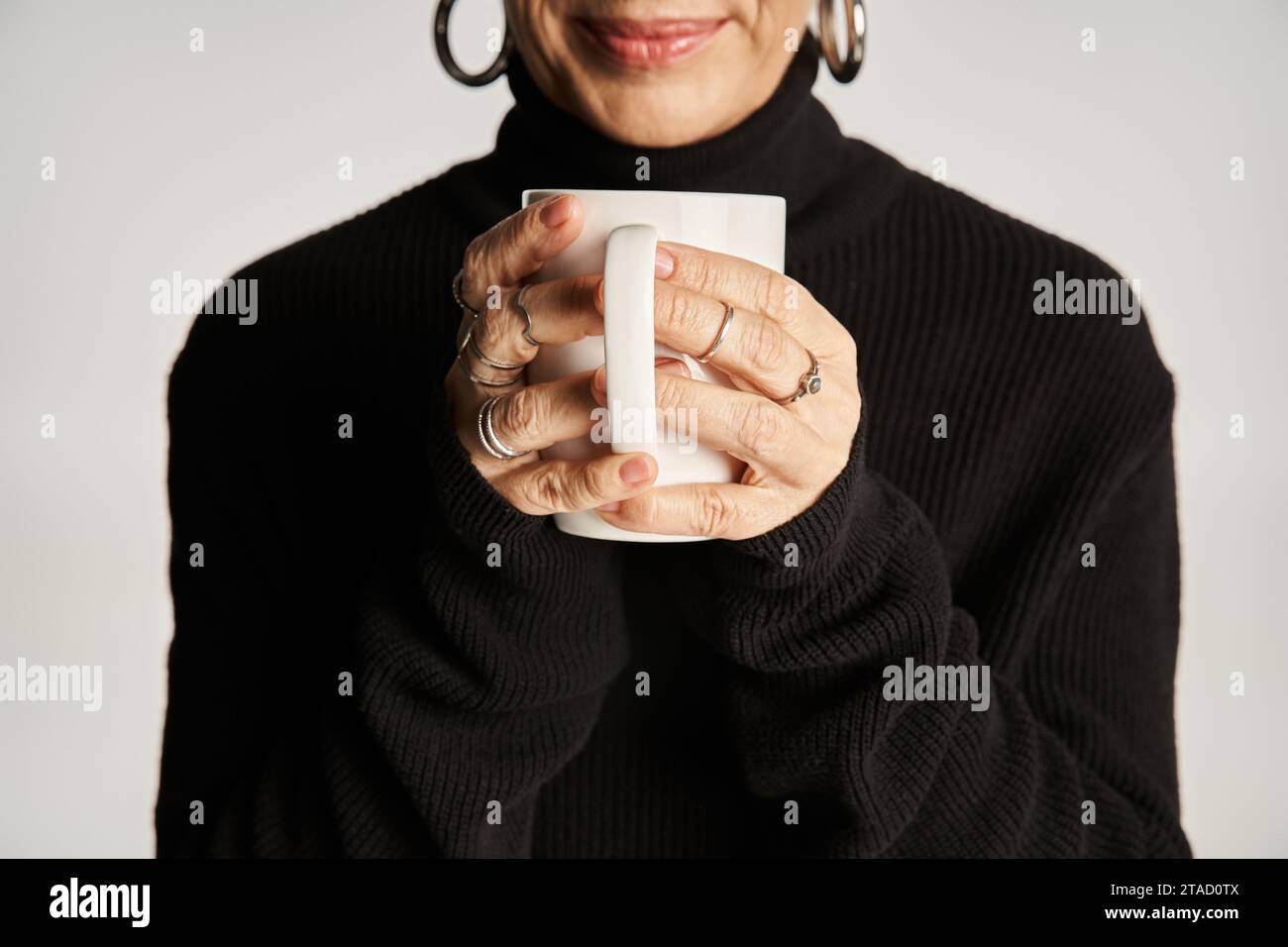 Hoop earrings and mature woman hi-res stock photography and images - Alamy