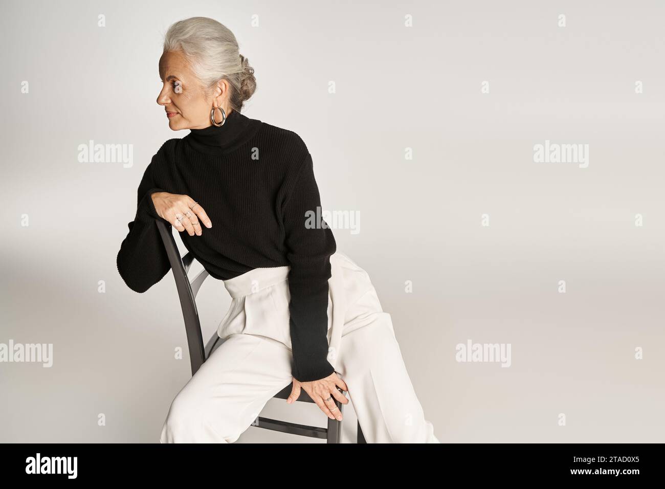 Hoop earrings and mature woman hi-res stock photography and images - Alamy