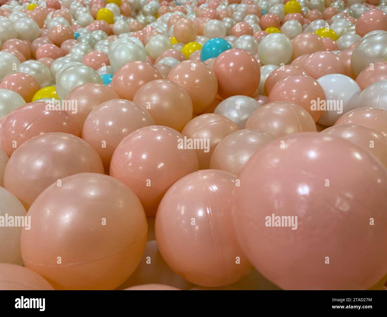 Many colorful plastic balls from above Stock Photo