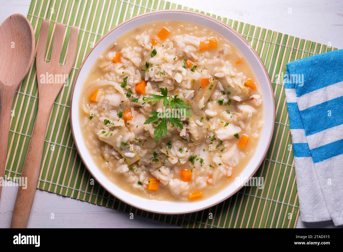 Soupy rice with artichokes and carrots. Typical Spanish gastronomy dish