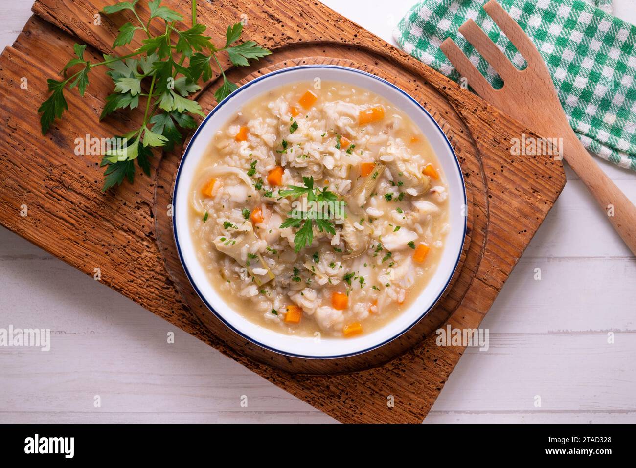 Soupy rice with artichokes and carrots. Typical Spanish gastronomy dish ...