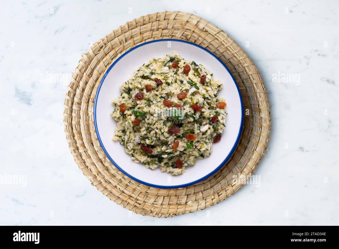 Rice with spinach and raisins. vegan recipe. Stock Photo