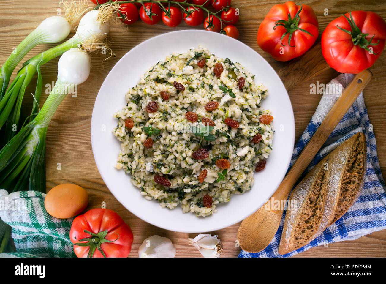 Rice with spinach and raisins. vegan recipe. Stock Photo