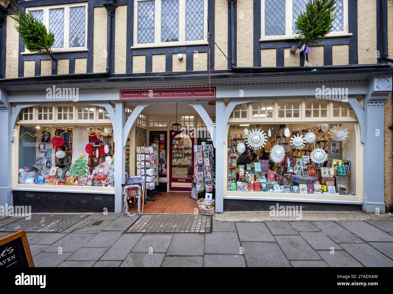 Winstone's Hunting Raven book shop front in historic Cheap Street, Frome, Somerset, UK on 30 November 2023 Stock Photo