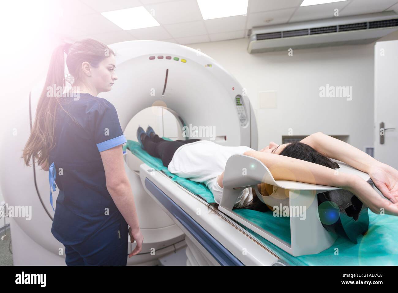 Radiologic technician and Patient being scanned and diagnosed on