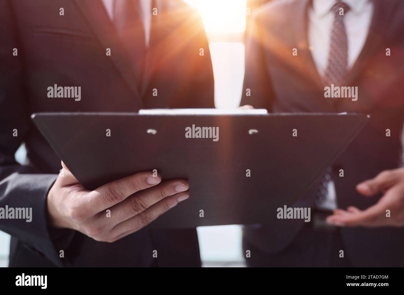 Two Businessmen Having Informal Meeting In Modern Office Stock Photo