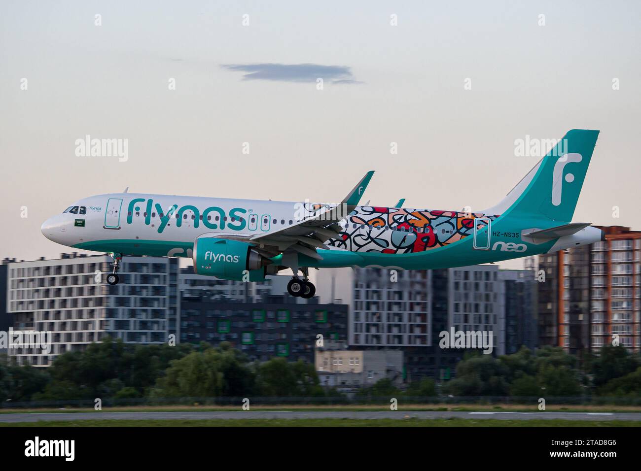 Saudi airline's Flynas Airbus A320 NEO in a 'Year of Arabic Calligraphy' livery landing at Lviv Airport after a flight from Riyadh Stock Photo