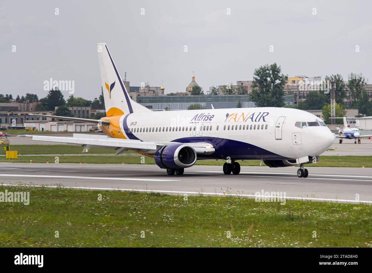 Ukrainian airline YanAir Boeing 737-400 slowing down after landing at Lviv Airport Stock Photo