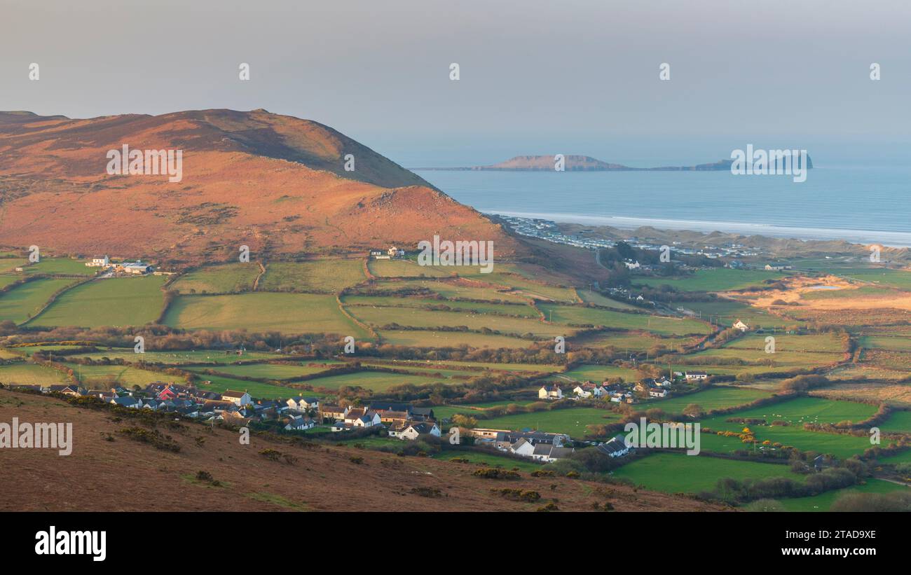 View from Llanmadoc Hill over the village of Llangennith towards Rhossili Bay and Worm's Head, Gower Peninsula, South Wales, UK. Spring (March) 2022. Stock Photo