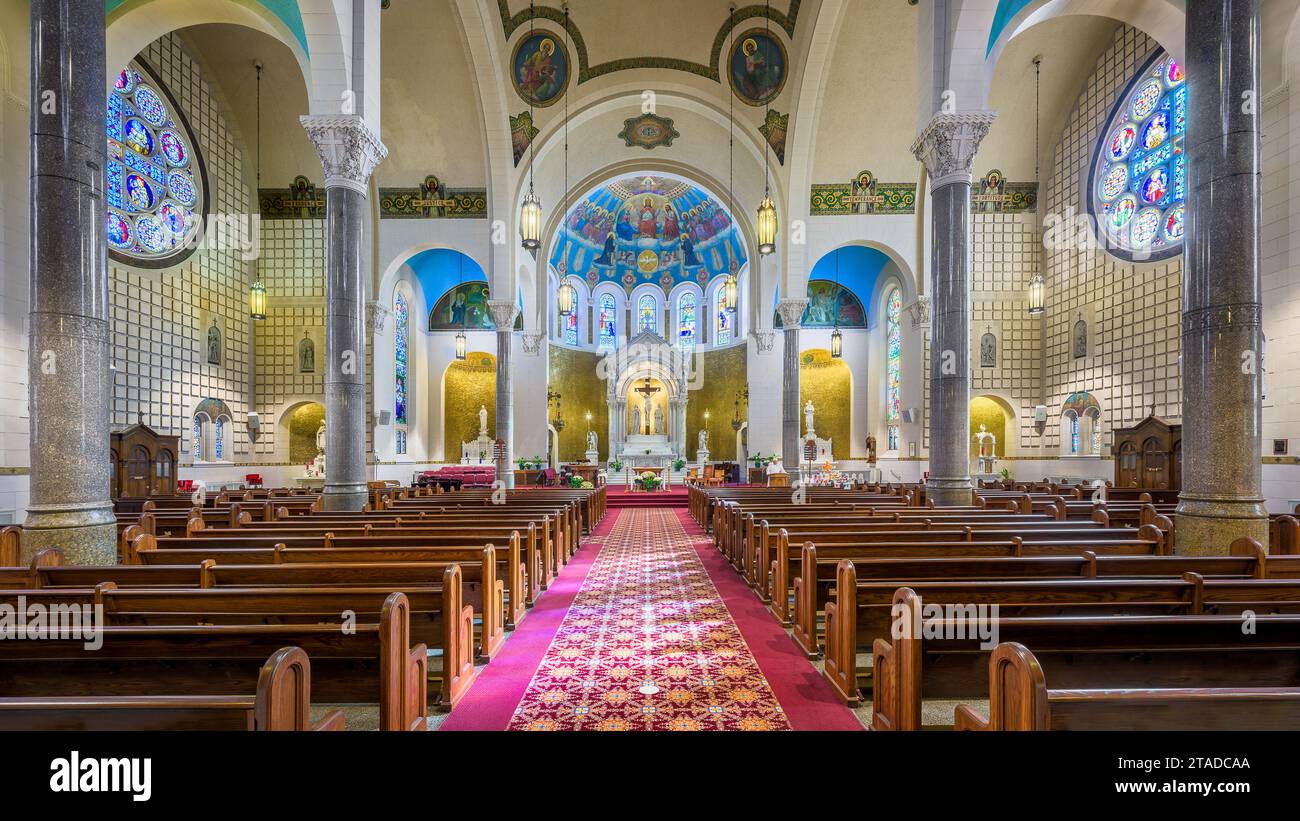 Interior nave and sanctuary of St Benedict Catholic Church in Terre Haute, Indiana Stock Photo