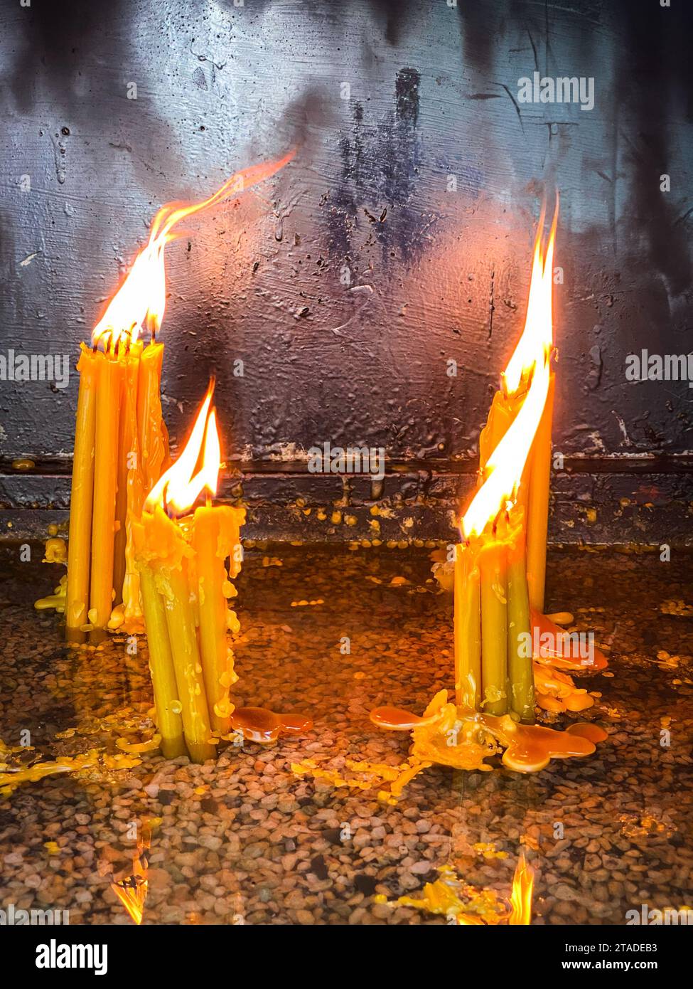 Сandles burning inside the church. Сhristian ceremony. Stock Photo