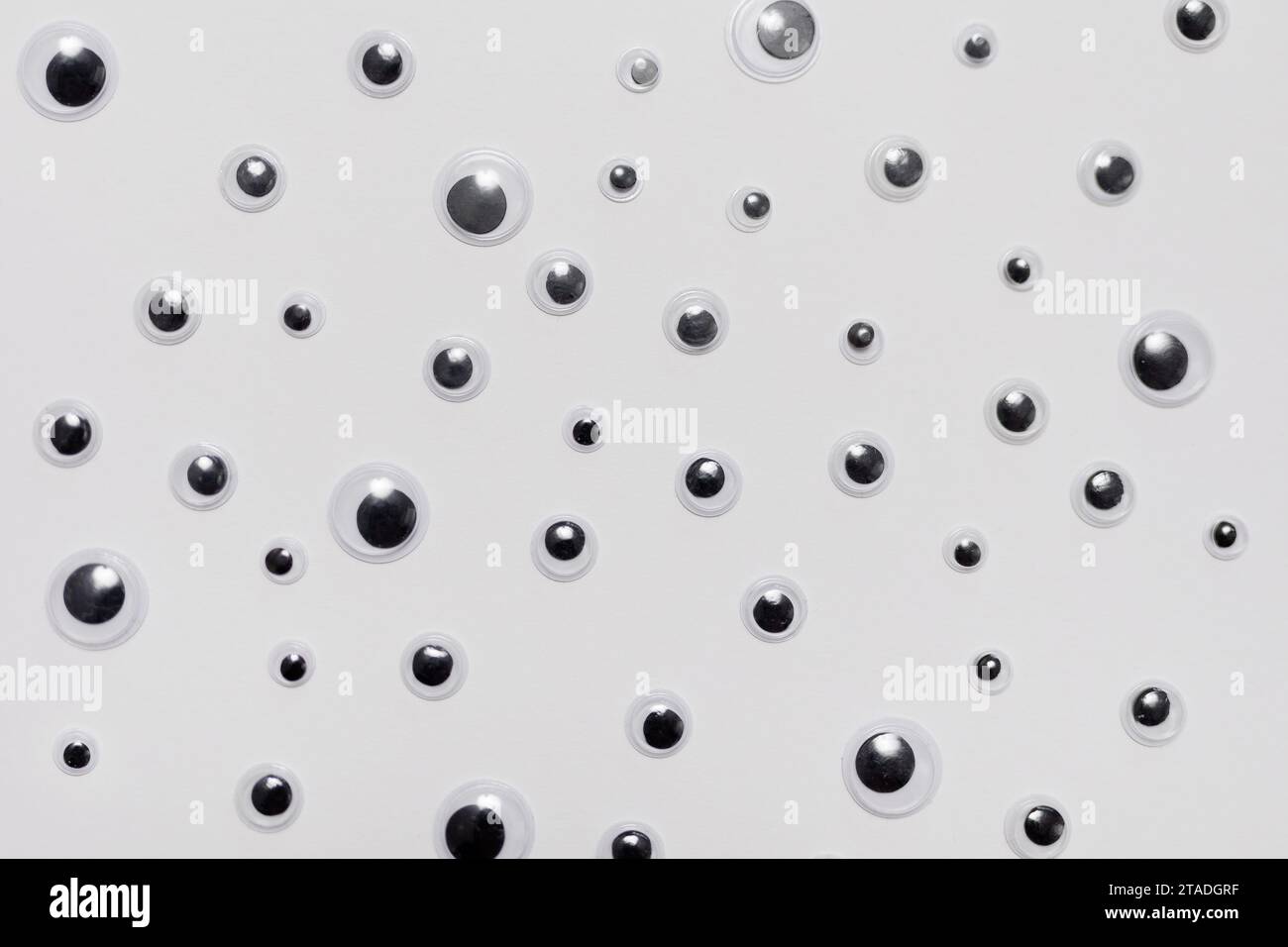Vertical pattern of sad googly eyes from clear, hard-plastic shell