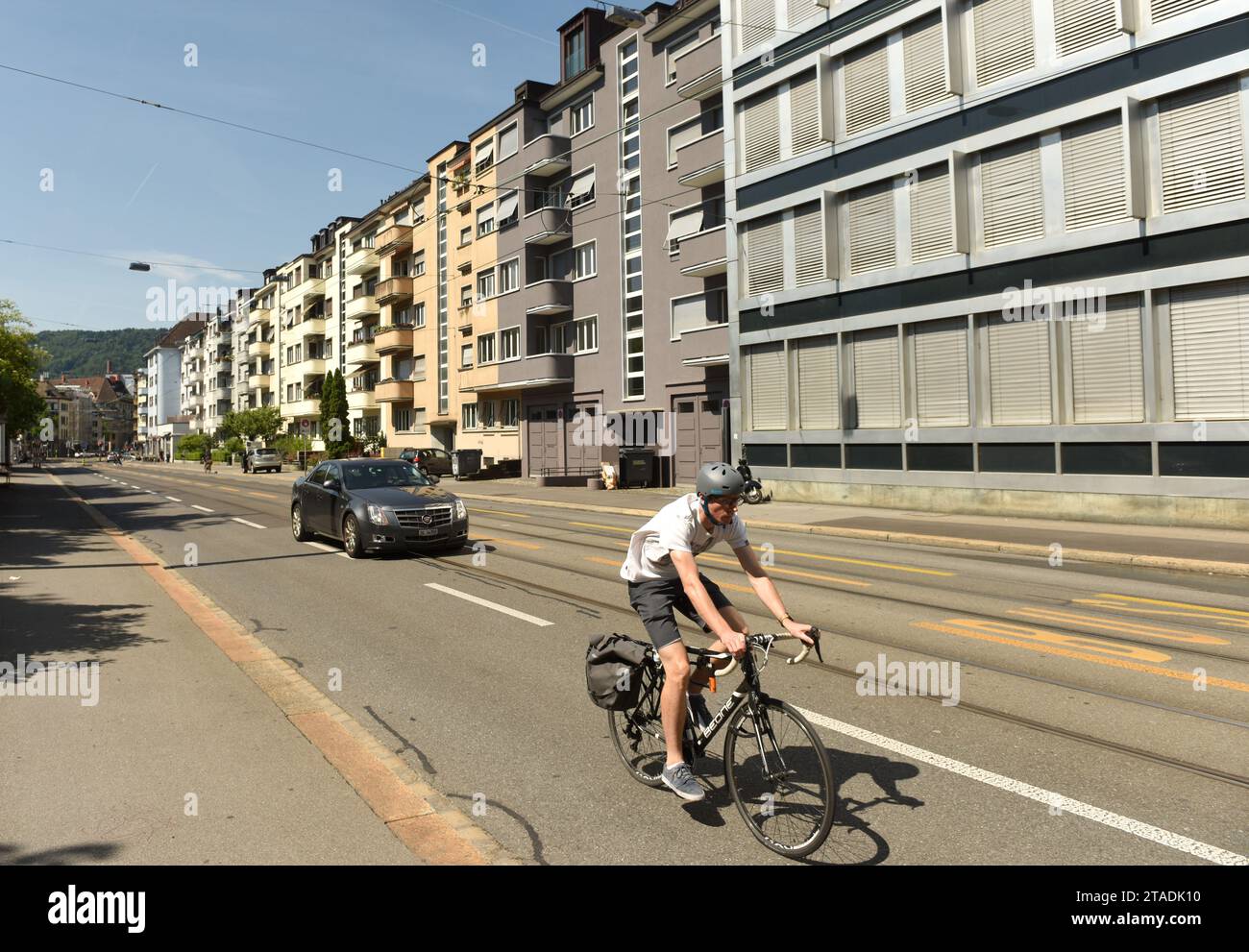 Zurich, Switzerland - June 03, 2017: Bicyclist on street of Zurich. Daily life in Zurich. Stock Photo