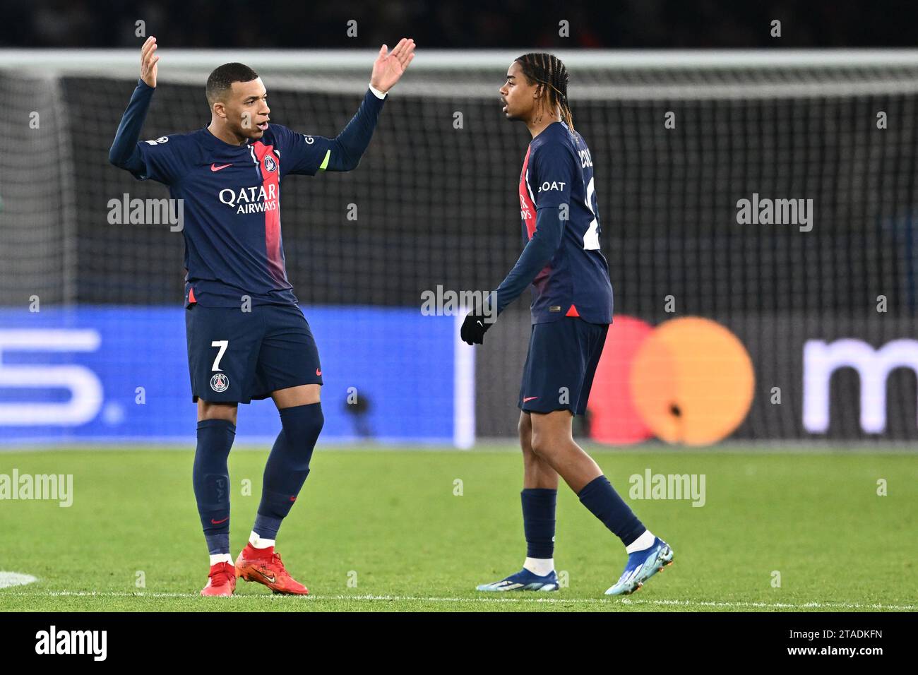 PARIS, FRANCE - NOVEMBER 28: Kylian Mbappe, Bradley Barcola of PSG celebrates after scoring a goal during the UEFA Champions League match between Pari Stock Photo