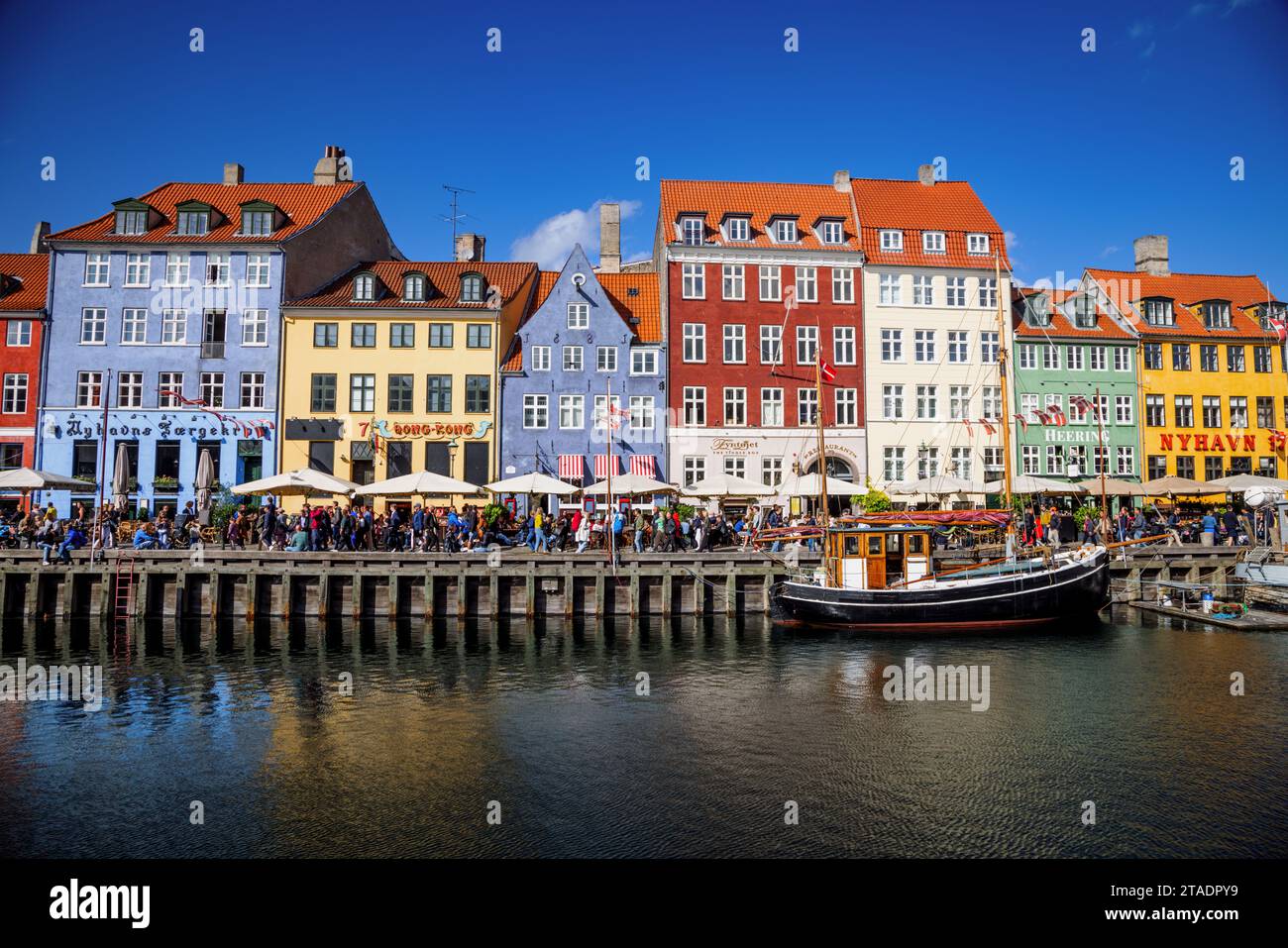 Colourful houses and historic boats in Nyhavn, Copenhagen, Denmark