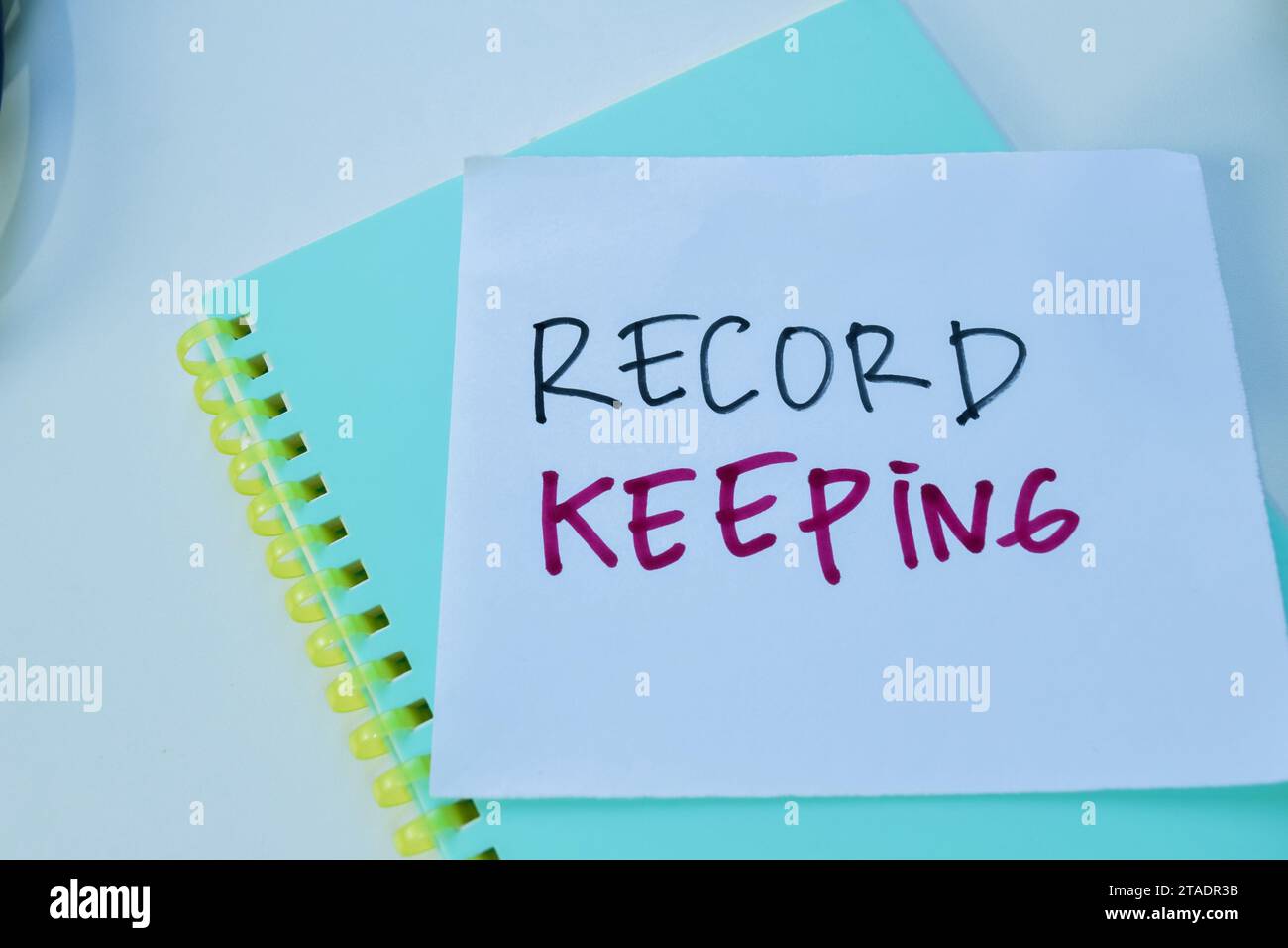 Concept of Record Keeping write on sticky notes isolated on white background. Stock Photo
