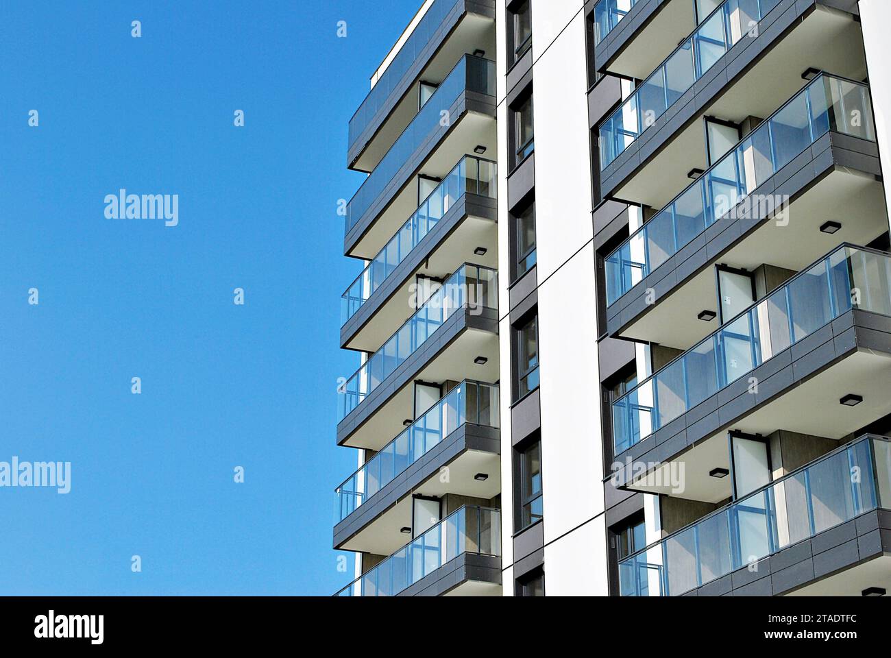 New apartment building with glass balconies. Modern architecture houses ...