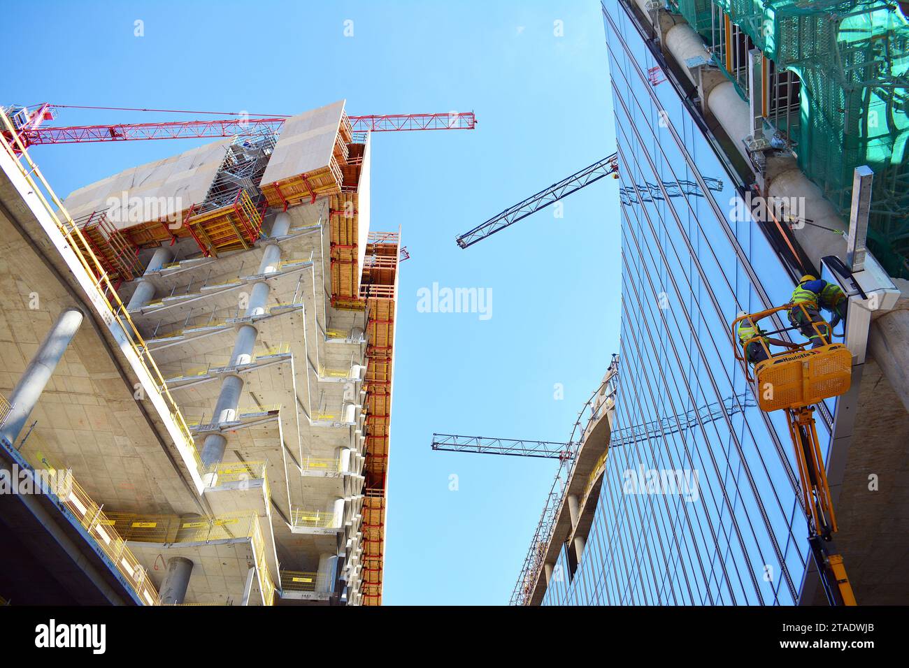 High rise building under construction. Installation of glass facade ...
