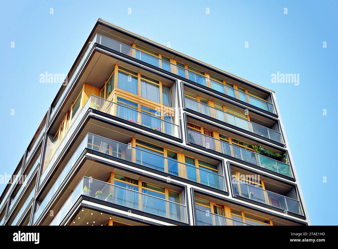 New apartment building with glass balconies. Modern architecture houses ...