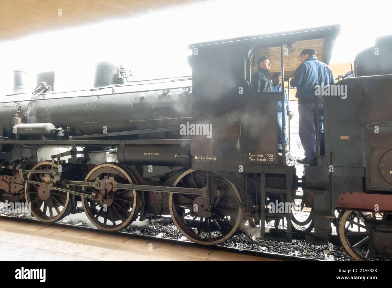 Old Italian restored steam locomotive treno natura,park on the platform. Siena, Italy Stock Photo