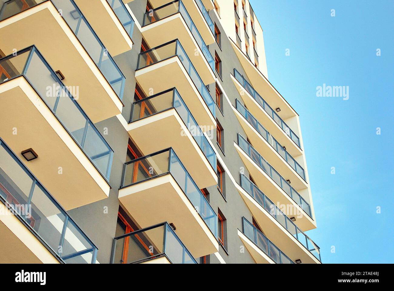New apartment building with glass balconies. Modern architecture houses ...