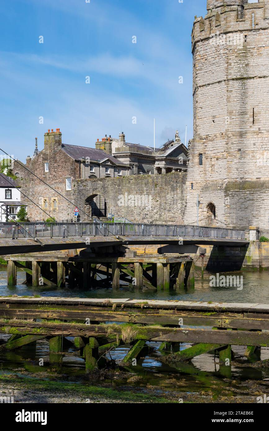 Walkway across the river Seiont to the Eagle tower of Caernarfon Castle, Gwynedd, North Wales Stock Photo