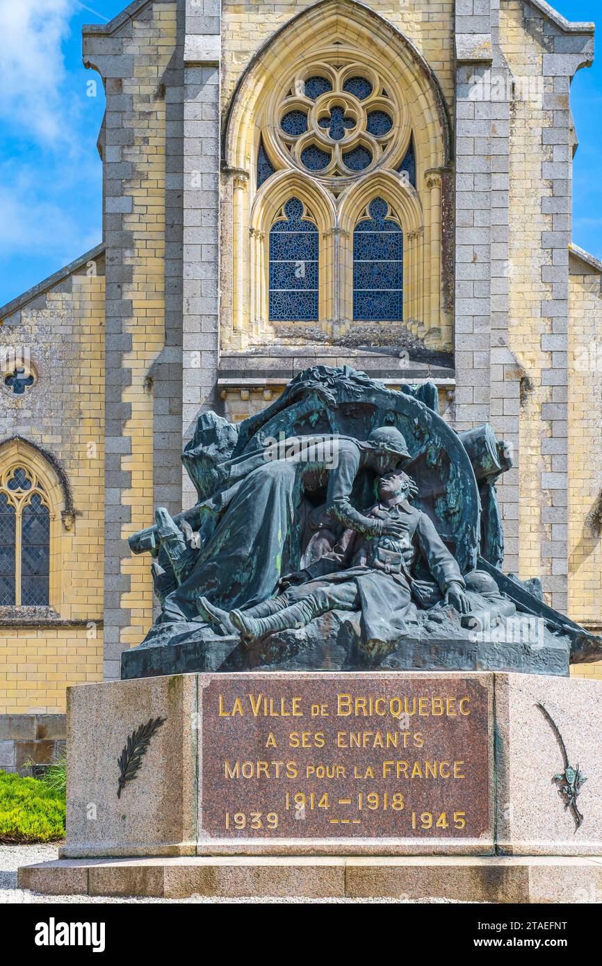 France, Manche, Cotentin, Bricquebec, war memorial in front of the neo-Gothic church of Our Lady of the Annunciation Stock Photo