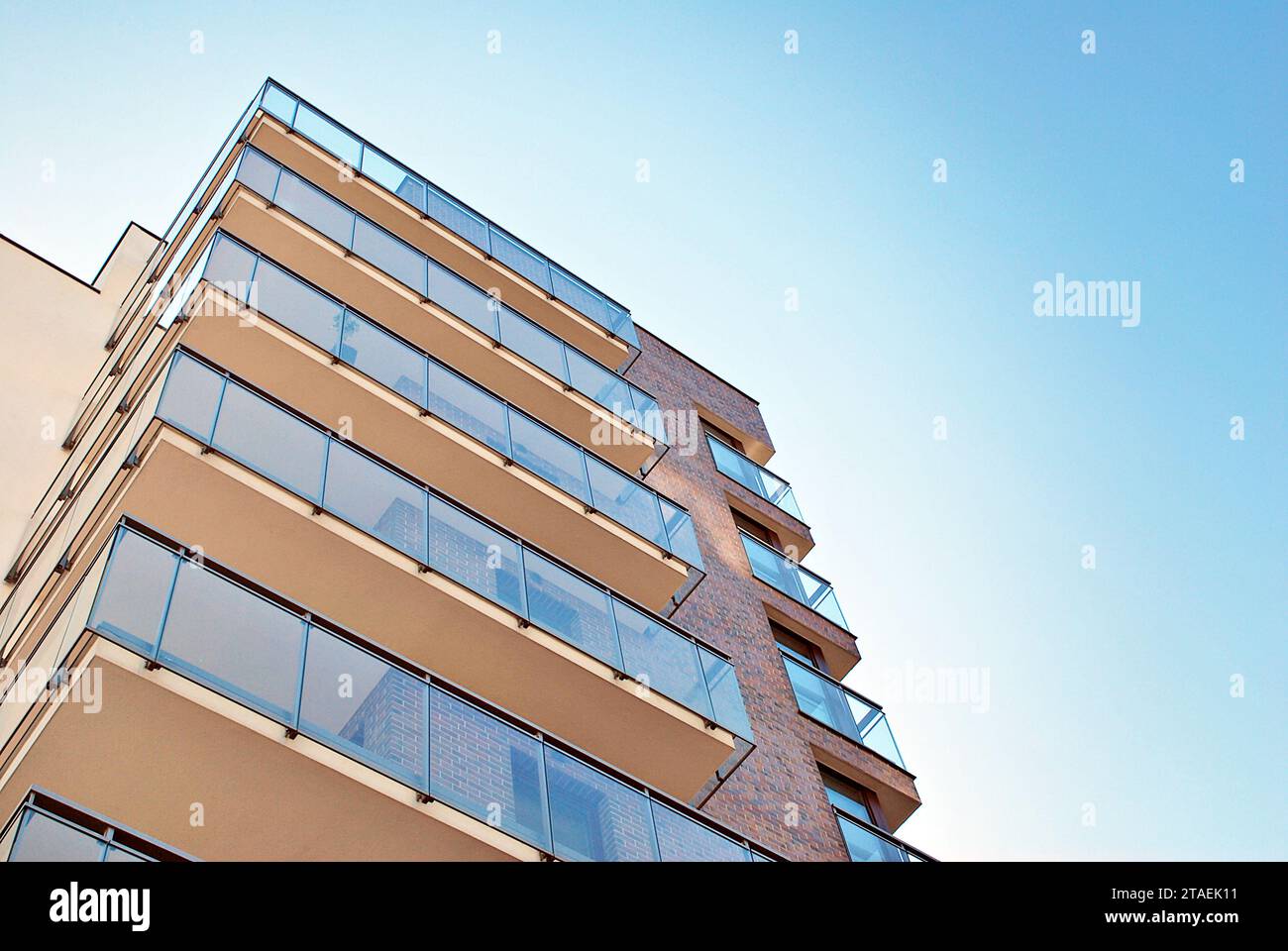 New apartment building with glass balconies. Modern architecture houses ...