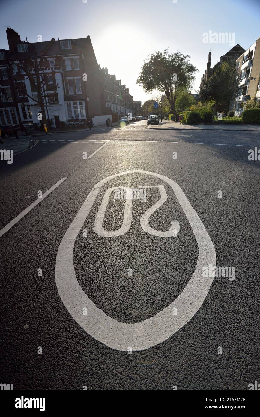 A 20 mph speed limit sign on a road in Kentish Town in North London UK Stock Photo