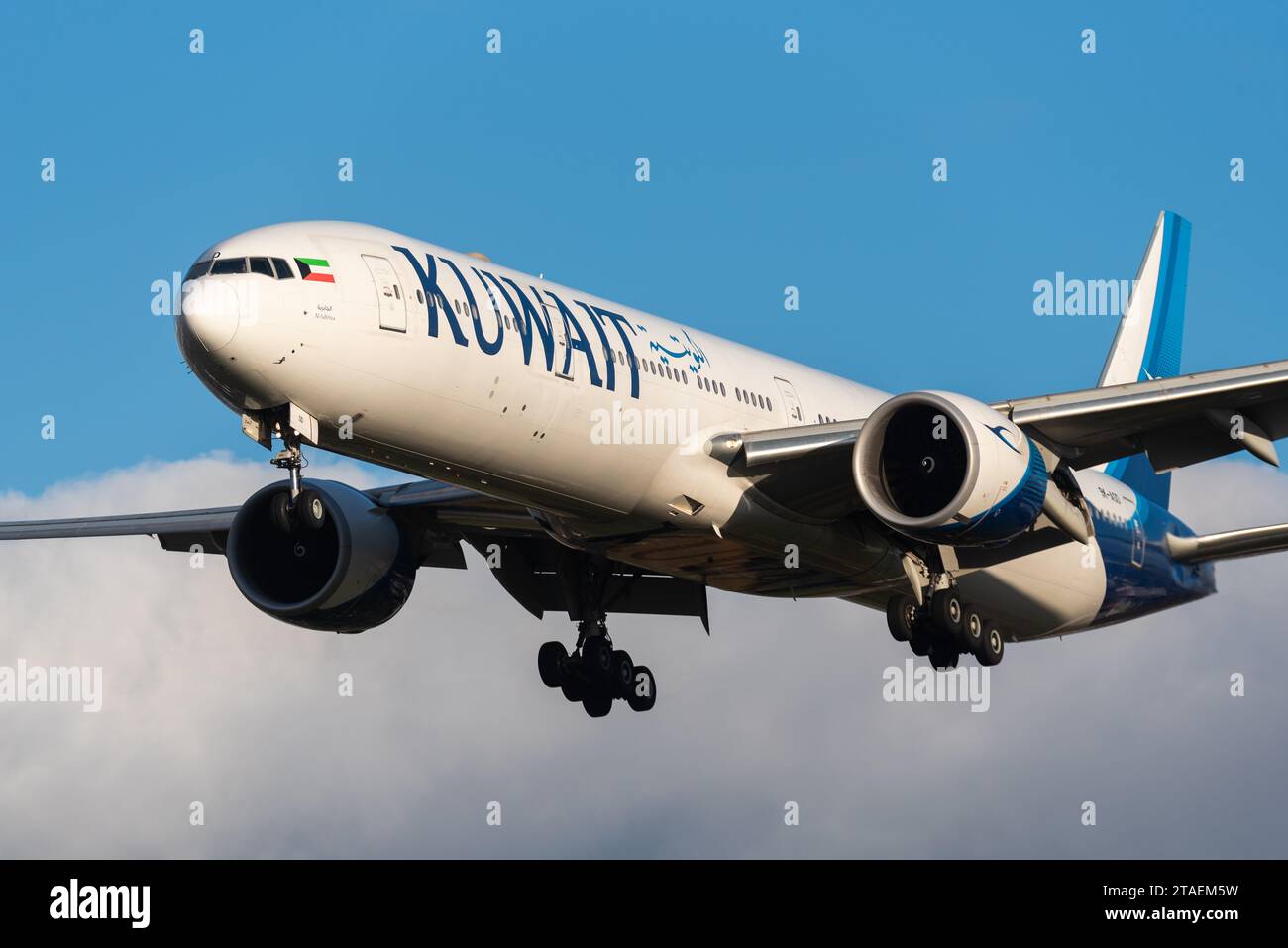 Kuwait Airways Boeing 777-300/ER airliner jet plane 9K-AOD on finals to land at London Heathrow Airport, UK, in late afternoon winter sun Stock Photo