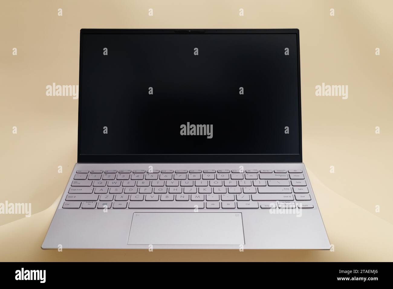 Modern laptop isolated on light yellowish background Stock Photo Alamy