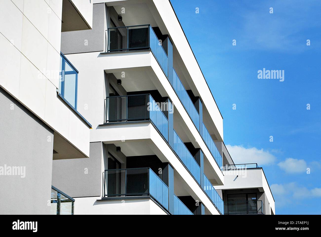 New apartment building with glass balconies. Modern architecture houses ...