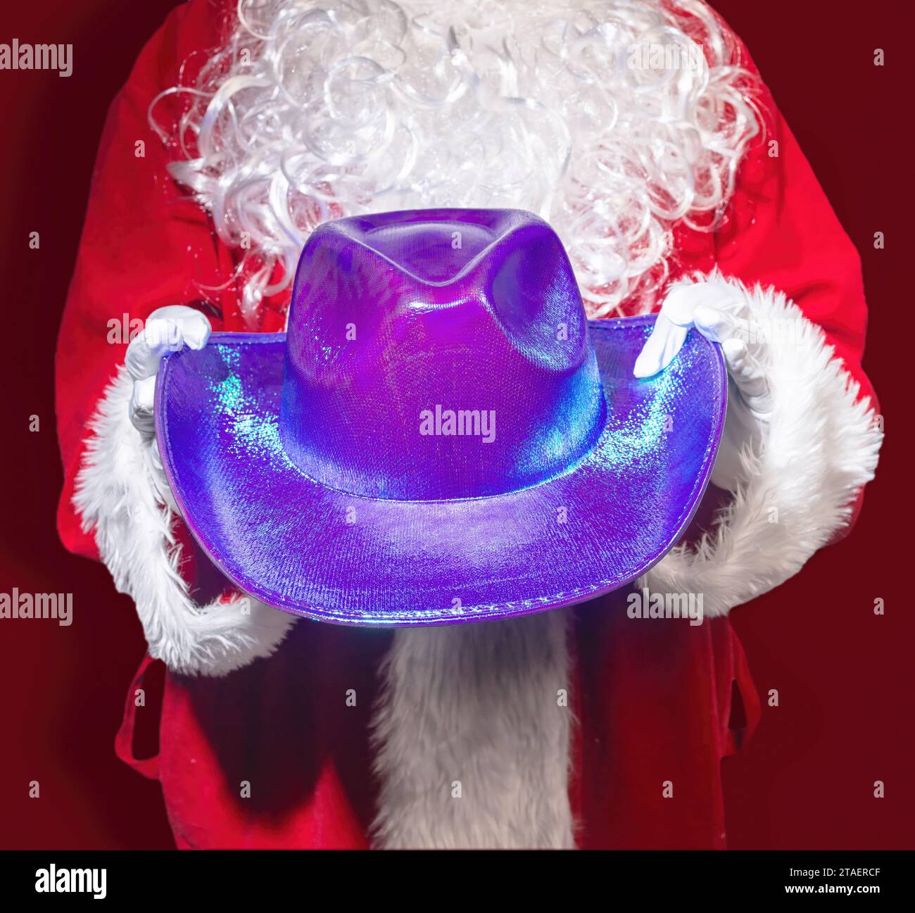 Santa Claus Holding a Western Purple Cowboy Hat, A Southern Christmas