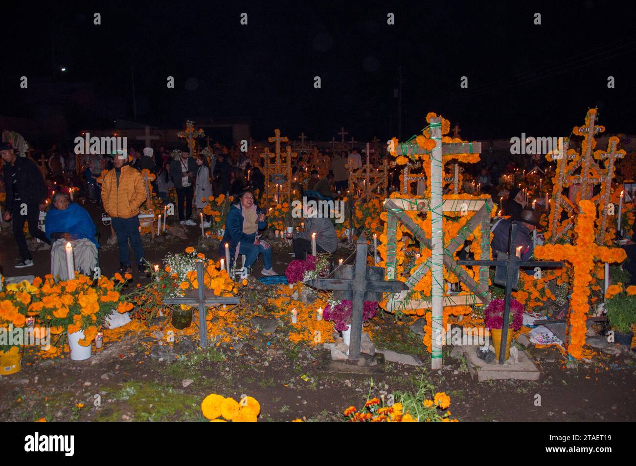 Tzintzuntzan, Michoacan, Mexico: November 1, 2023: Celebration of Day of the Dead with decoration of the cemetery and a candlelight vigil. Stock Photo