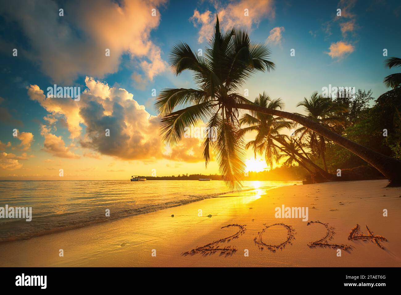 Happy New Year 2024 concept, lettering on the beach. Sea sunrise. Punta