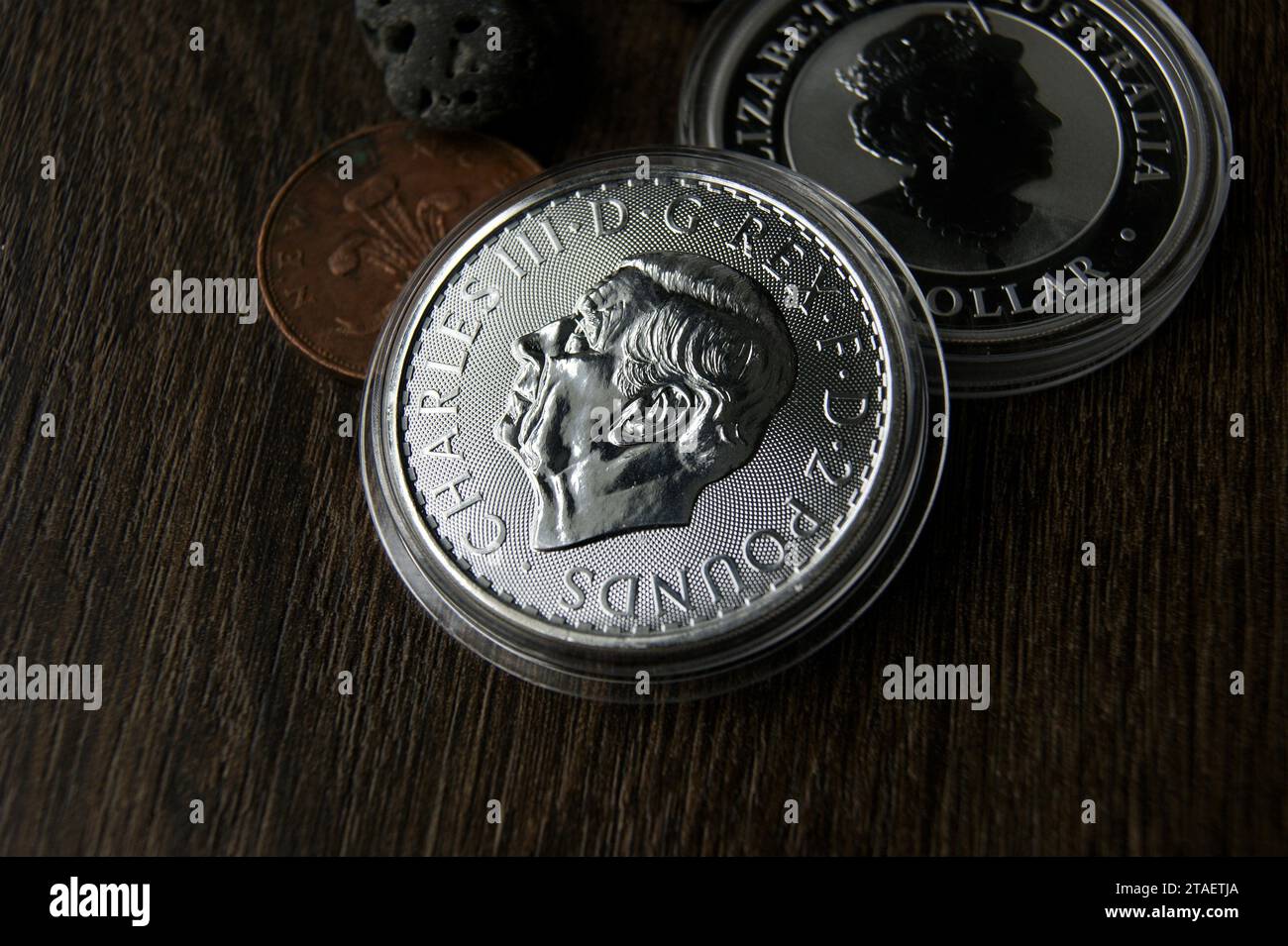 Investments and numismatics. British and Australian silver coins in capsules Stock Photo Alamy